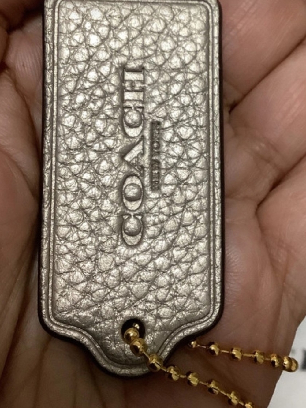 COACH Metallic Silver Pebbled Leather Phone Tag with Gold Ball Chain